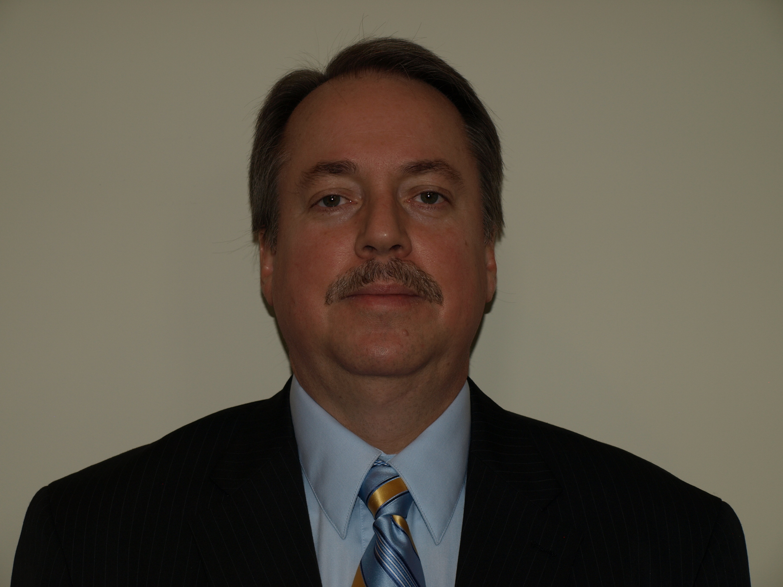 Professional headshot of Mark F. McLellan, founder of Active Search Results